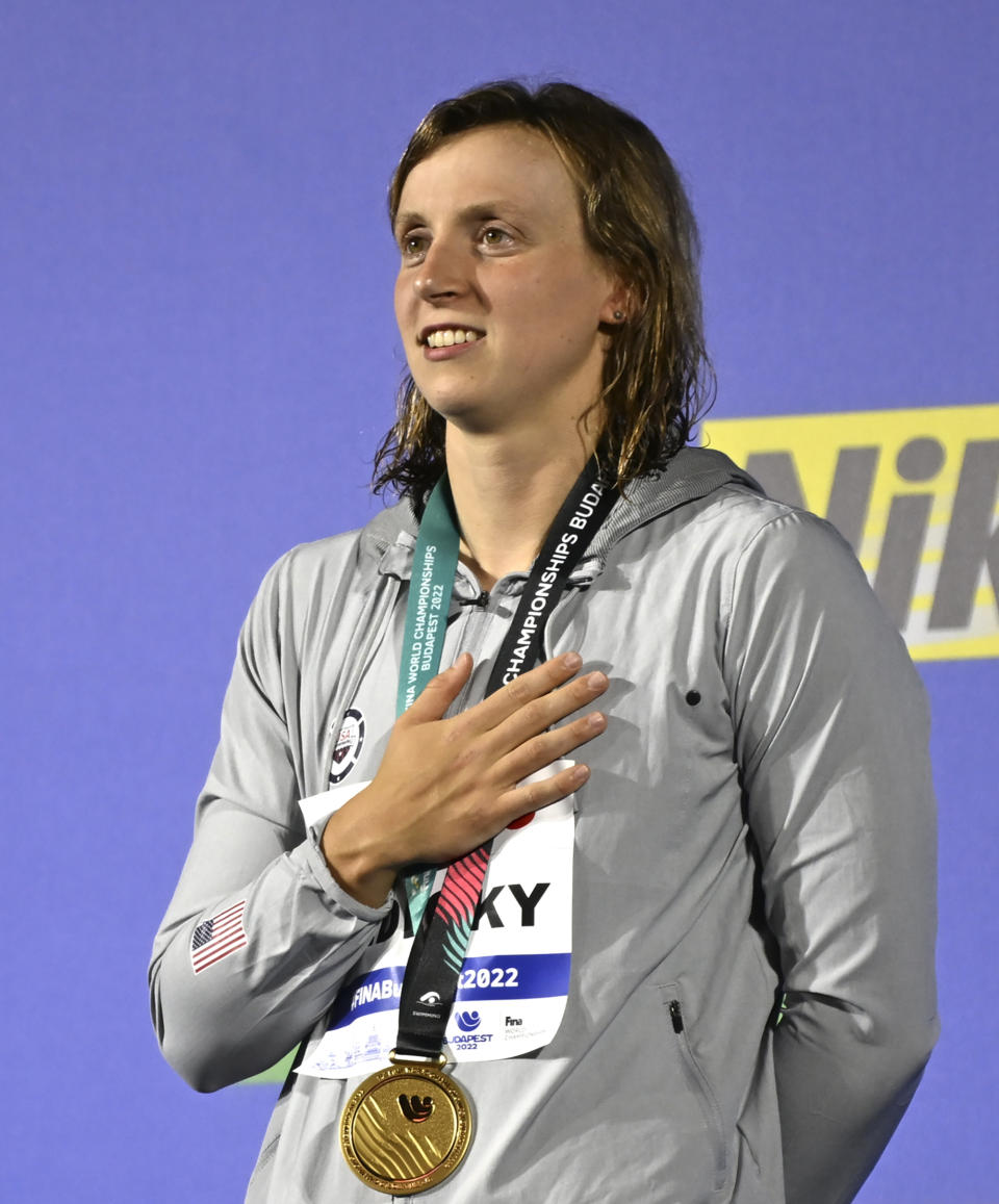 Gold medalist Katie Ledecky of the United States poses with her medal after the Women 800m Freestyle final at the 19th FINA World Championships in Budapest, Hungary, Friday, June 24, 2022. (AP Photo/Anna Szilagyi)