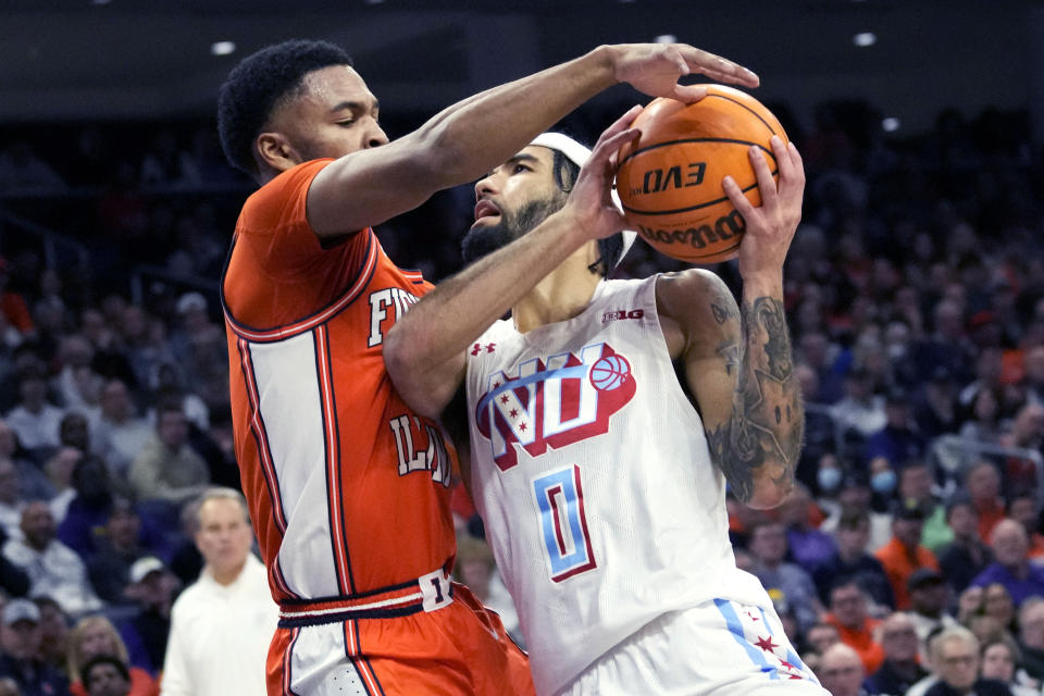 Northwestern guard Boo Buie, right, drives to the basket as Illinois guard Jayden Epps guards during the second half of an NCAA college basketball game in Evanston, Ill., Wednesday, Jan. 4, 2023. Northwestern won 73-60. (AP Photo/Nam Y. Huh)