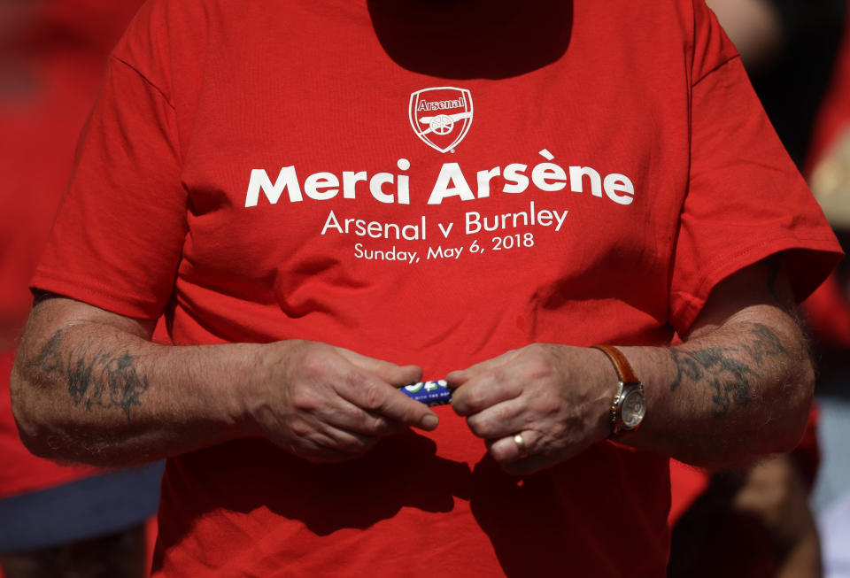 <p>A spectator wears a special t-shirt that reads “Merci Arsene” before the English Premier League soccer match between Arsenal and Burnley at the Emirates Stadium in London, Sunday, May 6, 2018. The match is Arsenal manager Arsene Wenger’s last home game in charge after announcing in April he will stand down as Arsenal coach at the end of the season after nearly 22 years at the helm. (AP Photo/Matt Dunham) </p>