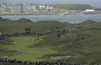 Northern Ireland's Rory McIlroy plays his approach shot to the 7th green during the first round of the British Open Golf Championships at Royal Portrush in Northern Ireland, Thursday, July 18, 2019.(AP Photo/Matt Dunham)