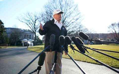 Donald Trump addresses the cameras on Thursday morning outside of the White House - Credit: REUTERS/Carlos Barria