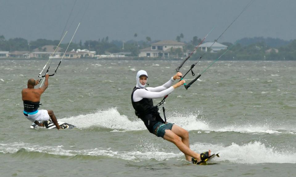 A group of kiteboarding enthusiasts took advantage of the increased winds from the outer bands of Hurricane Idalia on Wednesday. They were across from Bicentennial Memorial park, in an area called the 520 Slick, along the Banana River Lagoon between Merritt Island and Cocoa Beach.