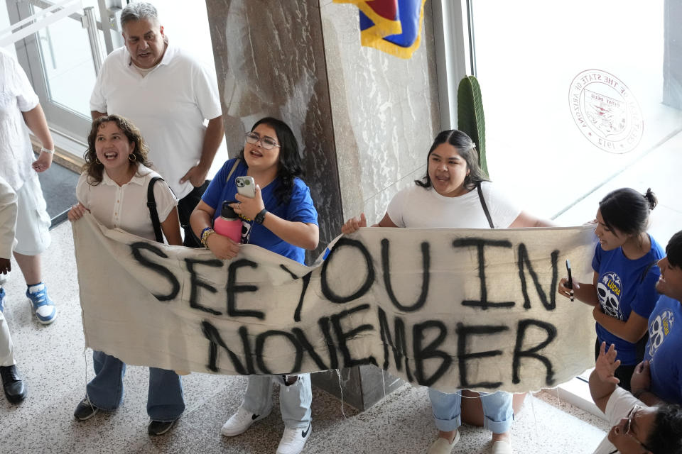 FILE - Opponents to an immigration proposal gather inside the Arizona State Capitol, Tuesday, June 4, 2024, in Phoenix. (AP Photo/Matt York, File)