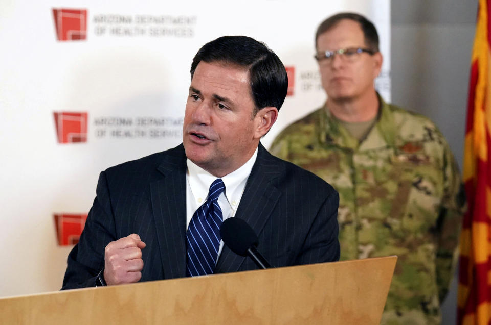 Image: Arizona Governor Doug Ducey holds a press conference on coronavirus in Phoenix on March 25, 2020. (Rob Schumacher / The Arizona Republic via AP file)