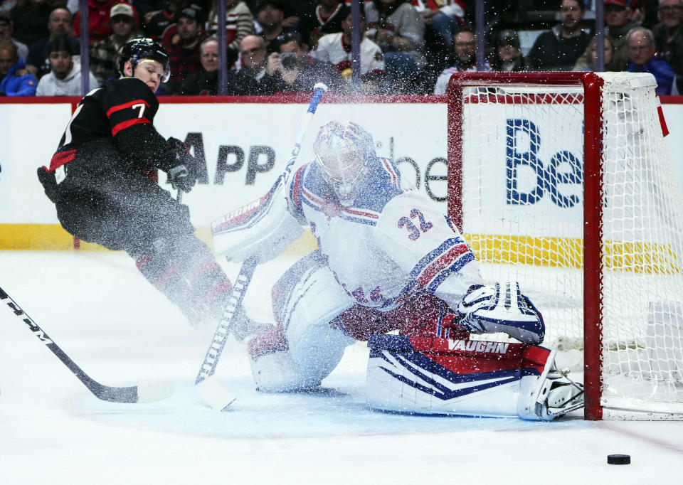 Ottawa Senators left wing Brady Tkachuk (7) looks towards New York Rangers goaltender Jonathan Quick (32) as he makes a save during the first period of an NHL hockey game Saturday, Jan. 27, 2024 in Ottawa, Ontario. (Sean Kilpatrick/The Canadian Press via AP)