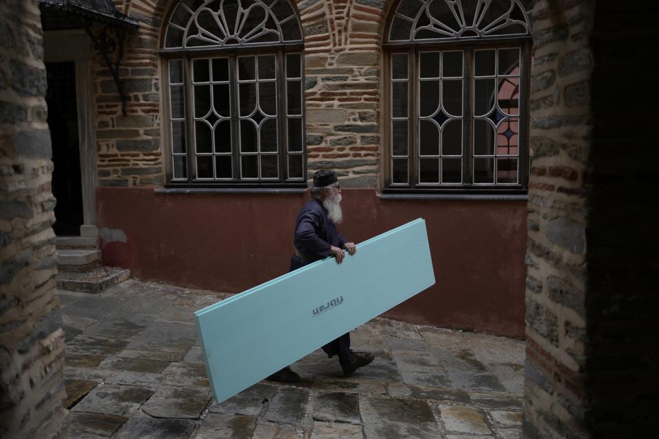 A monk carries supplies for the Pantokrator Monastery in the Mount Athos, northern Greece, on Friday, Oct. 14, 2022. The monastic community was first granted self-governance through a decree by Byzantine Emperor Basil II, in 883 AD. Throughout its history, women have been forbidden from entering, a ban that still stands. This rule is called "avaton" and the researchers believe that it concerns every form of disturbance that could affect Mt. Athos. (AP Photo/Thanassis Stavrakis)