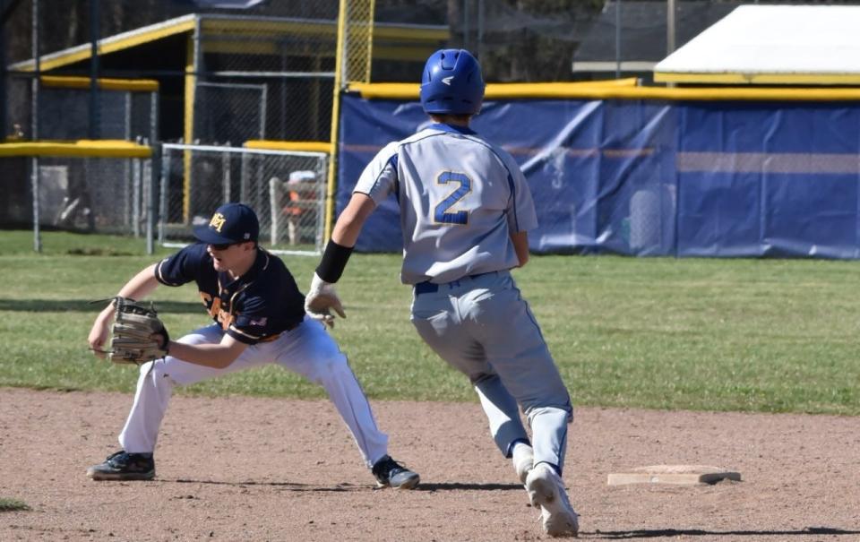 Erie Mason’s Anderson Moore takes a throw at second base with Owen Snyder of Ida approaching the base on Monday, April 15, 2024. Ida swept the doubleheader 7-6 and 10-0 for its first two wins of the season.