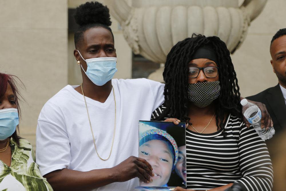 Myron Hammonds, left, and Paula Bryant, father and mother of Ma’Khia Bryant, the 16-year-old girl shot and killed by a Columbus police officer on April 20, hold a photo of their daughter during a news conference Wednesday, April 28, 2021, in Columbus, Ohio. (AP Photo/Jay LaPrete)