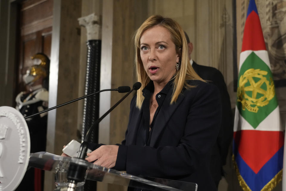 Brothers of Italy's leader Giorgia Meloni reads to the media the list of the ministers of Italy's new government after presenting it to Italian President Sergio Mattarella, at the Quirinale Presidential Palace, in Rome, Friday, Oct. 21, 2022. (AP Photo/Gregorio Borgia)