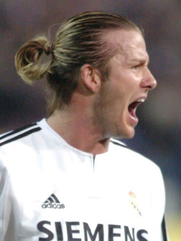 Carlos Alvarez /Getty David Beckham yells during a soccer match against Atletico de Madrid on April 17, 2004, in Madrid, Spain.