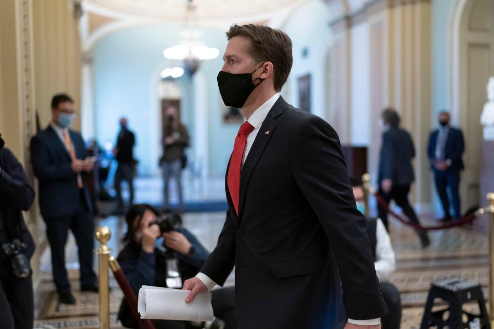 Sen. Ben Sasse, R-Neb., leaves the chamber as the Senate voted to consider hearing from witnesses in the impeachment trial of former President Donald Trump, at the Capitol in Washington, Saturday, Feb. 13, 2021.