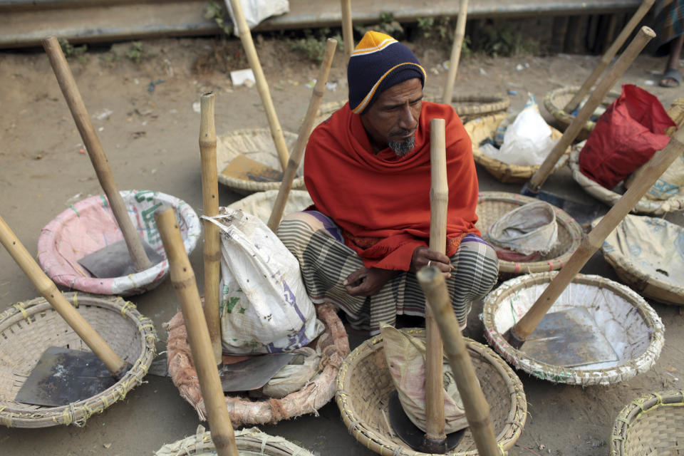 A Bangladeshi daily wage laborer waits for contract during a 48-hour nationwide strike called by the main opposition Bangladesh Nationalist Party (BNP) against Sunday'a general election, in Dhaka, Bangladesh, Monday, Jan. 6, 2014. Bangladesh's ruling Awami League won one of the most violent elections in the country's history, marred by street fighting, low turnout and a boycott by the opposition that made the results a foregone conclusion. (AP Photo/A.M. Ahad)