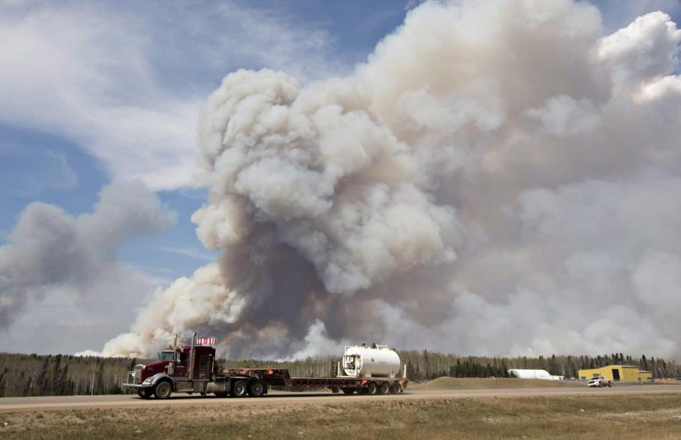 A wildfire rages through Fort McMurray, Alta, on Wednesday May 4, 2016. THE CANADIAN PRESS/Jason Franson