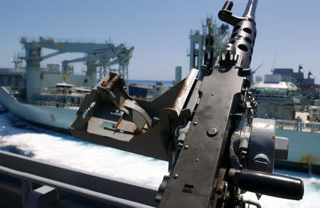 A gun can be seen on board the Royal Australian Navy frigate HMAS Stuart as the Royal Canadian Navy vessel MV Asterix pulls alongside during Australia's largest maritime exercise 'Exercise Kakadu' being conducted off the coast of Darwin in northern Australia, September 7, 2018. Picture taken September 7, 2018. REUTERS/Jill Gralow