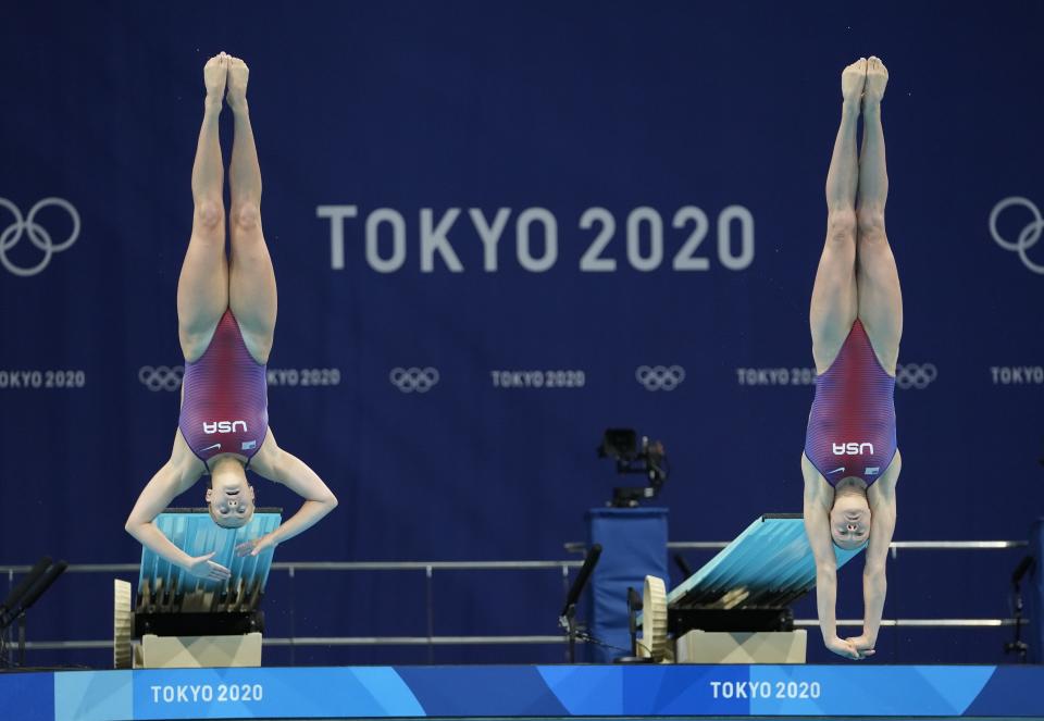 Alison Gibson and Krysta Palmer of the United States' compete during the Women's Synchronized 3m Springboard Final at the Tokyo Aquatics Centre at the 2020 Summer Olympics, Sunday, July 25, 2021, in Tokyo, Japan. (AP Photo/Dmitri Lovetsky)