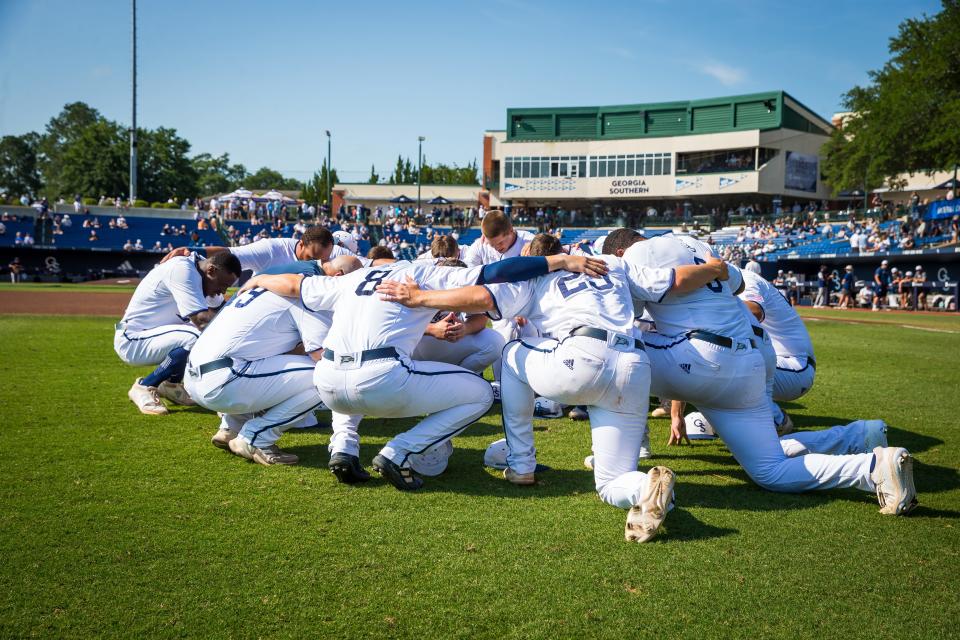 The first seed Georgia Southern baseball team huddles before its Statesboro Regional opener against NC Greensboro on Saturday at J.I. Clements Stadium. The Eagles won 8-0 to advance to a winners' bracket game later Saturday against second seed Notre Dame.