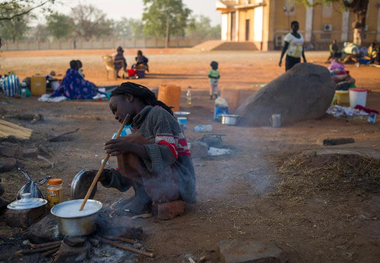 A displaced South Sudanese woman on January 13, 2014 in the grounds of St. Theresa's cathedral in Juba, where over 100 people sought refuge amid fighting between government forces and rebels allied to Riek Machar