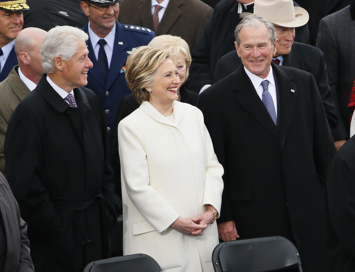 Former Secretary of State Hillary Clinton stands between former Presidents Bill Clinton and George W. Bush during inauguration ceremonies swearing in Donald Trump as the 45th president of the United States on the West front of the U.S. Capitol in Washington, U.S., January 20, 2017. REUTERS/Rick Wilking 