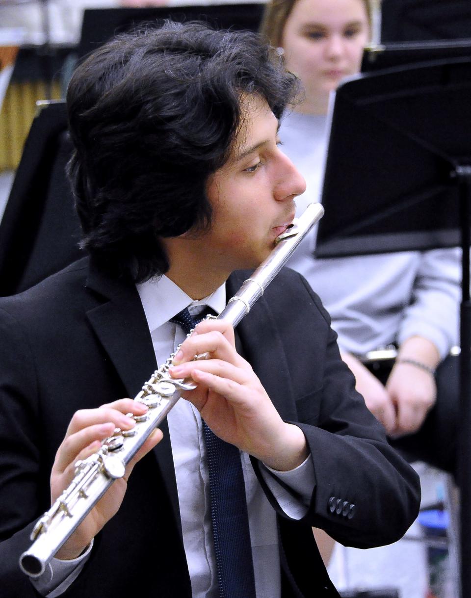 Jhon Fajardo, a senior at Wooster High School, plays his flute in the symphonic band class as the class rehearsse some songs for an upcoming concert at Severance Hall. Farjardo said he has been playing the flute since fourth grade and is very excited for their upcoming performance.