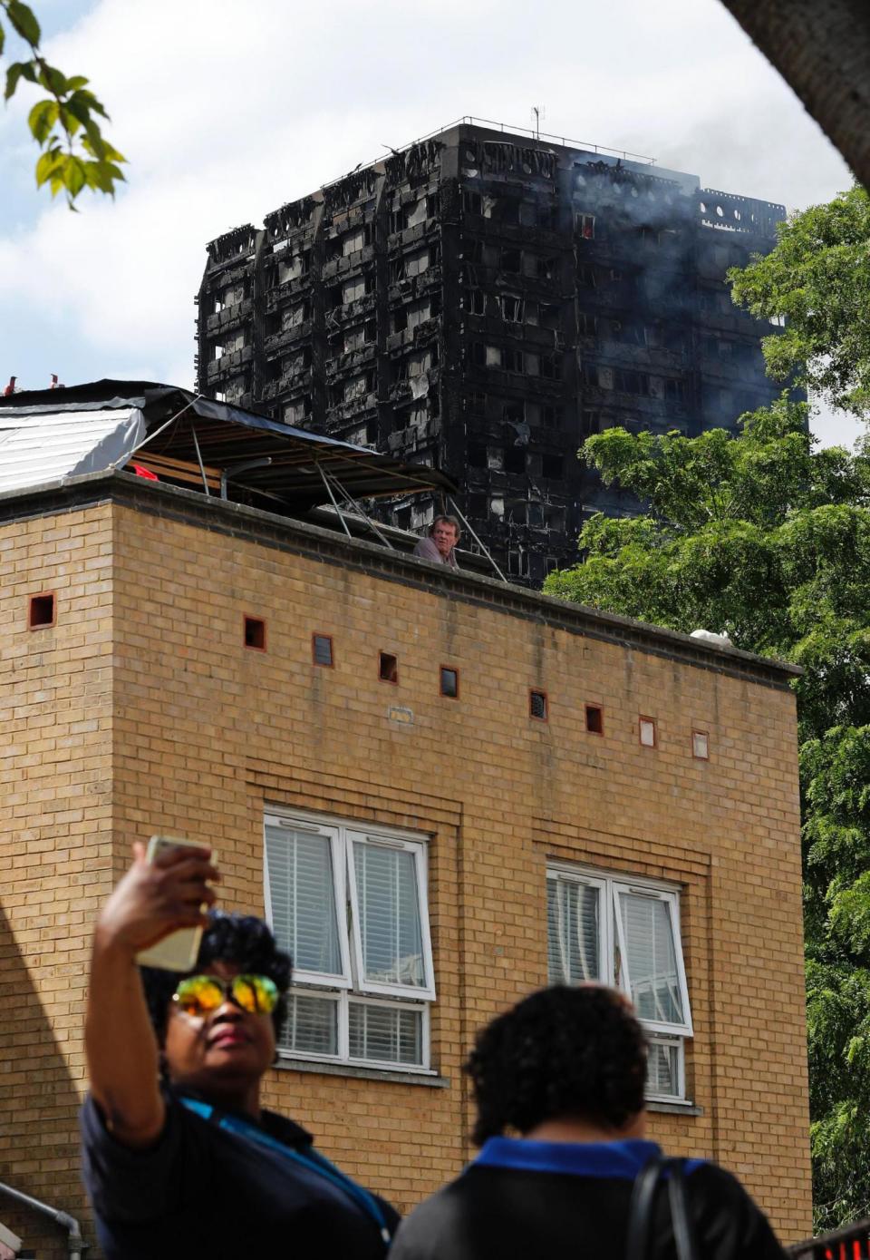 Grenfell Tower: Residents urge visitors to stop taking selfie with blackened building (AFP/Getty Images)