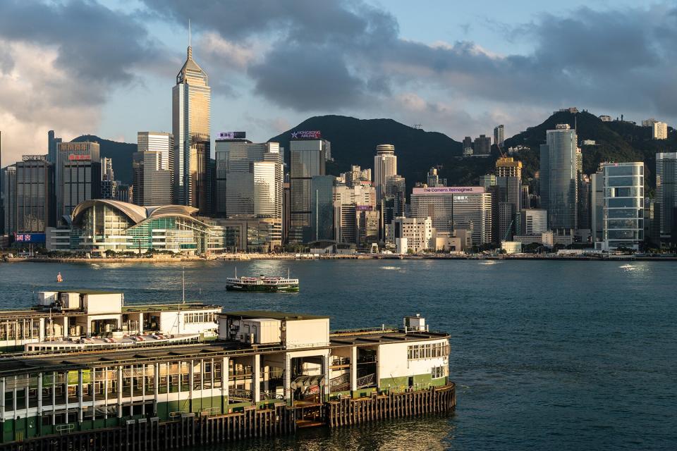 Tsim Sha Tsui star ferry pier with Hong Kong island skyline