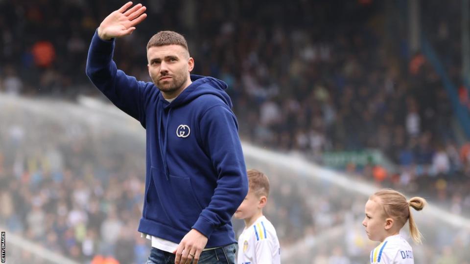 Stuart Dallas is presented on the pitch at Elland Road following his retirement