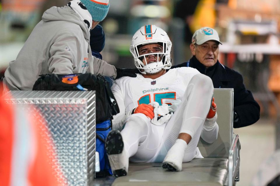 Miami Dolphins linebacker Jaelan Phillips (15) is carted to the locker room after being injured during the second half in Friday's game against the New York Jets in East Rutherford, N.J.