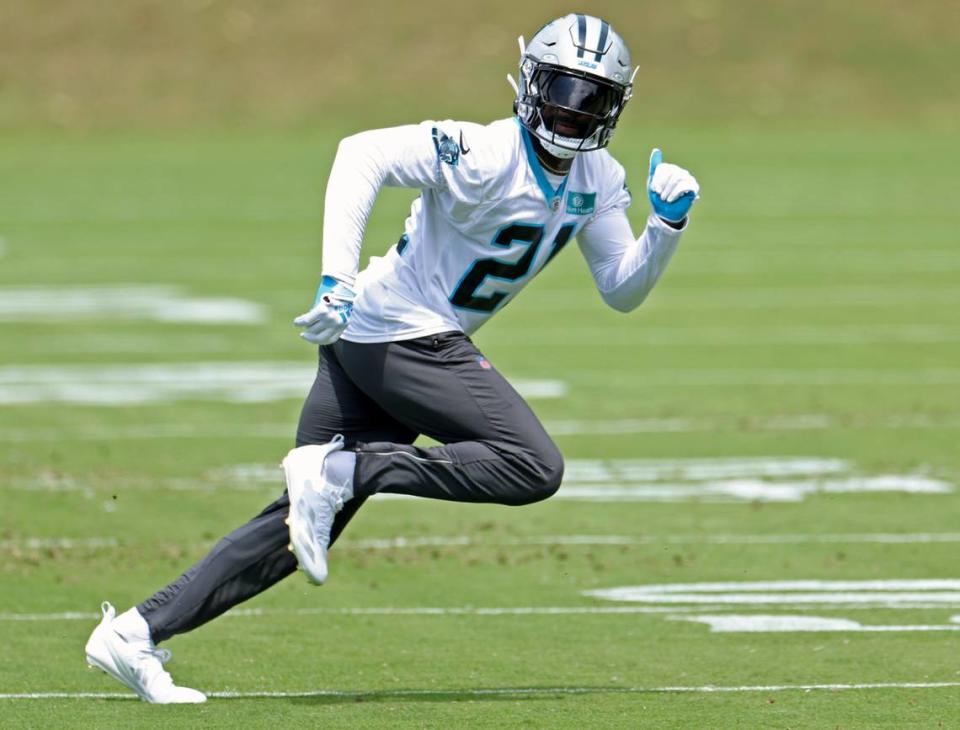 Carolina Panthers safety Nick Scott runs across the field watching the path of a ball during the team’s voluntary minicamp practice on Wednesday, April 24, 2024.