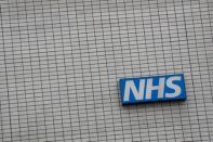 An NHS sign is seen at St Thomas' Hospital in central London, Britain May 12, 2017. REUTERS/Stefan Wermuth