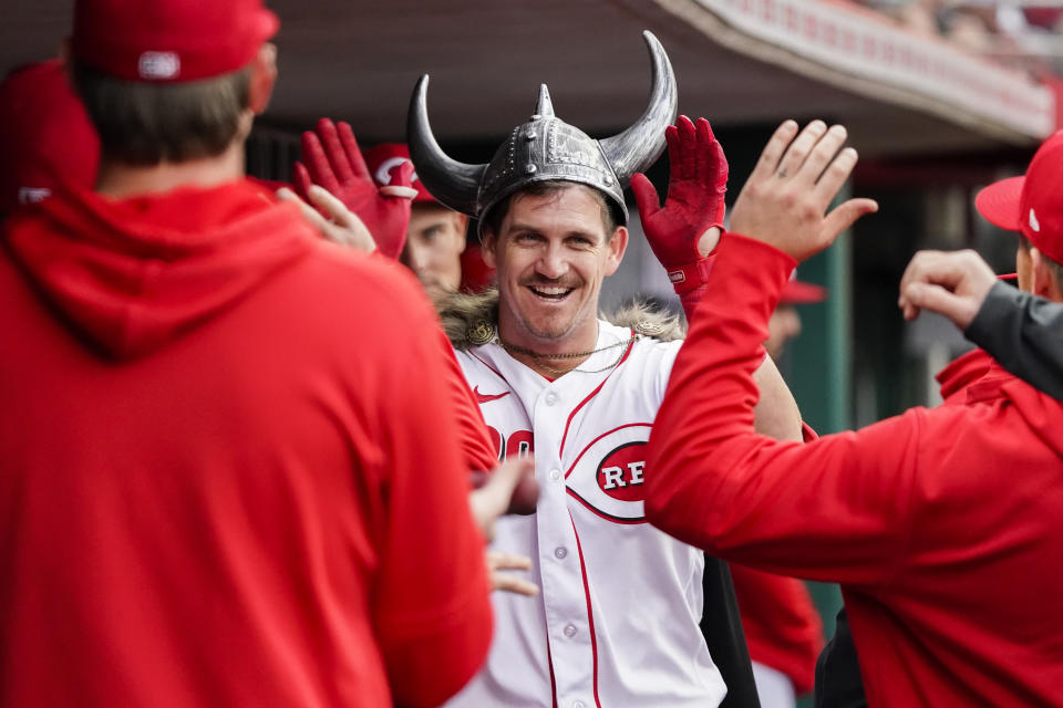 Cincinnati Reds designated hitter Kevin Newman celebrates with teammates after hitting a solo home run during the second inning of a baseball game against the Tampa Bay Rays, Monday, April 17, 2023, in Cincinnati. (AP Photo/Joshua A. Bickel)