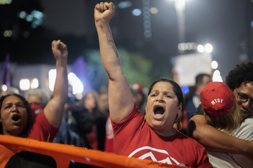 Demonstrators shout slogans against Brazilian former President Jair Bolsonaro during a protest calling for protection of the nation's democracy in Sao Paulo, Brazil, Monday, Jan. 9, 2023, the day after Bolsonaro supporters stormed government buildings in the capital. (AP Photo/Andre Penner)