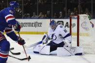 Tampa Bay Lightning goaltender Andrei Vasilevskiy (88) makes a save against a shot by New York Rangers center Barclay Goodrow (21) during the second period of an NHL hockey game, Sunday, Jan 2, 2022, at Madison Square Garden in New York. (AP Photo/Rich Schultz)
