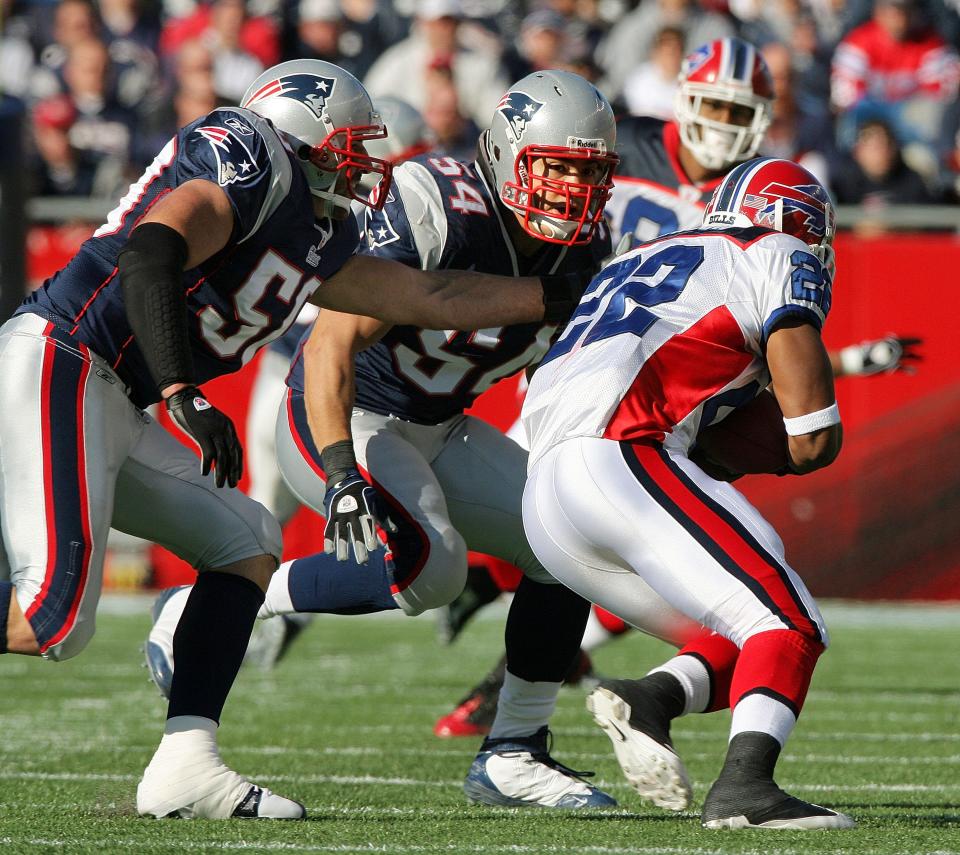 ORG XMIT:  Sunday November 9, 2008Foxboro, MAThe Providence Journal/Bob BreidenbachThe New England Patriots host the Buffalo Bills at Gillette Stadium.New England Patriots linebackers  Mike Vrabel (left) and Tedy Bruschi (center) converge on Buffalo Bills running back Fred Jackson #22 in the 1st quarter.