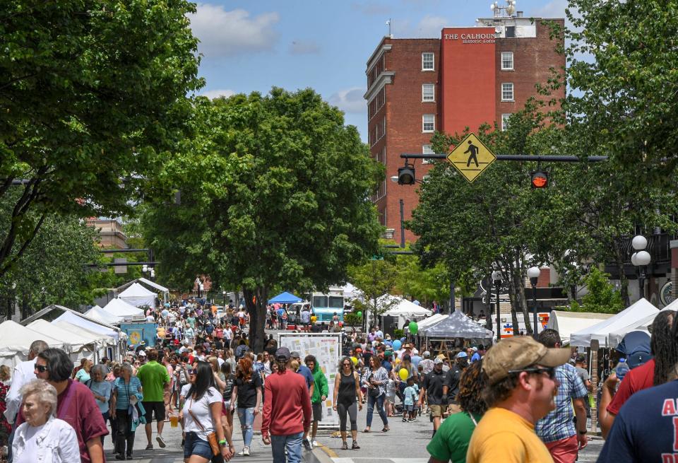 People walk along North Main Street near The Calhoun Historic Lofts  during the 2023 Anderson Soirée in Anderson, S.C.