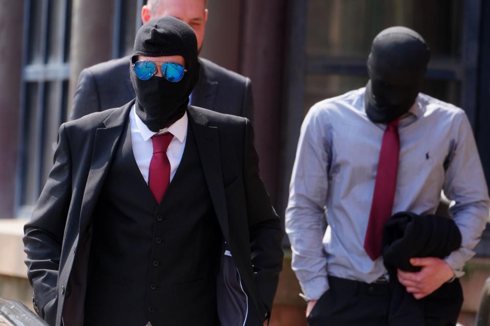 Daniel Graham, left, and Adam Carruthers, right, wore masks outside court (Owen Humphreys/PA) (PA Wire)