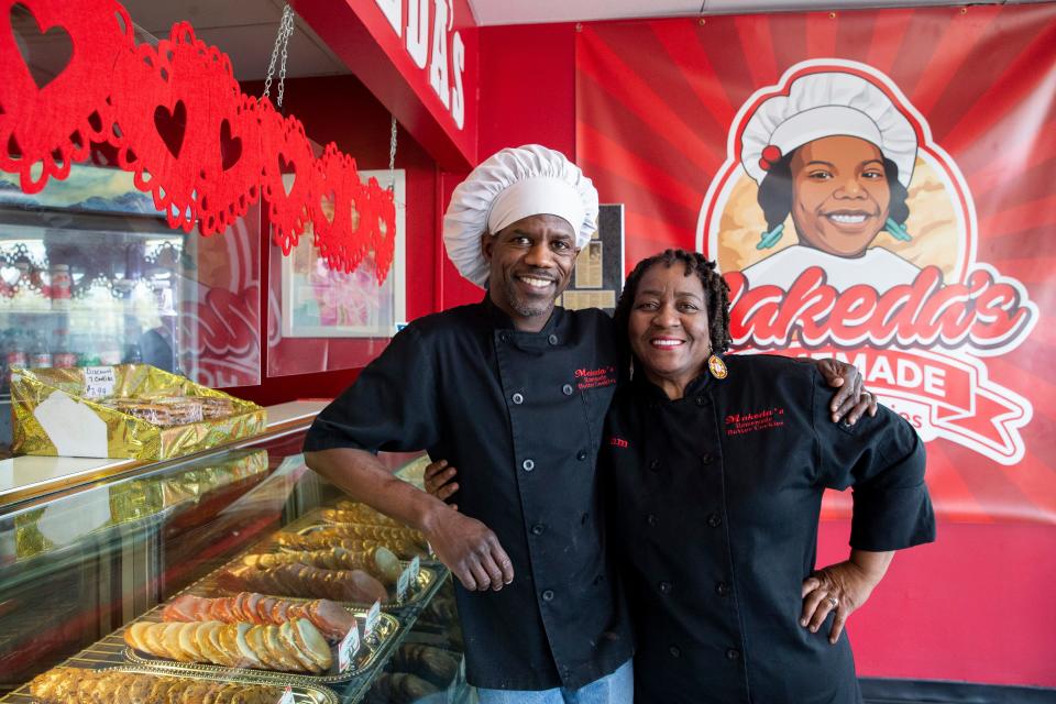 Maurice and Pamela Hill, the owners of Makeda’s Homemade Butter Cookies, pose for a portrait in one of their bakeries on Thursday, February 1, 2024.