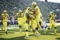 Oct 13, 2018; Eugene, OR, USA; Oregon Ducks running back CJ Verdell (34) celebrates with teammates after scoring the game winning touchdown in overtime against the Washington Huskies at Autzen Stadium. The Ducks won 30-27. Mandatory Credit: Troy Wayrynen-USA TODAY Sports