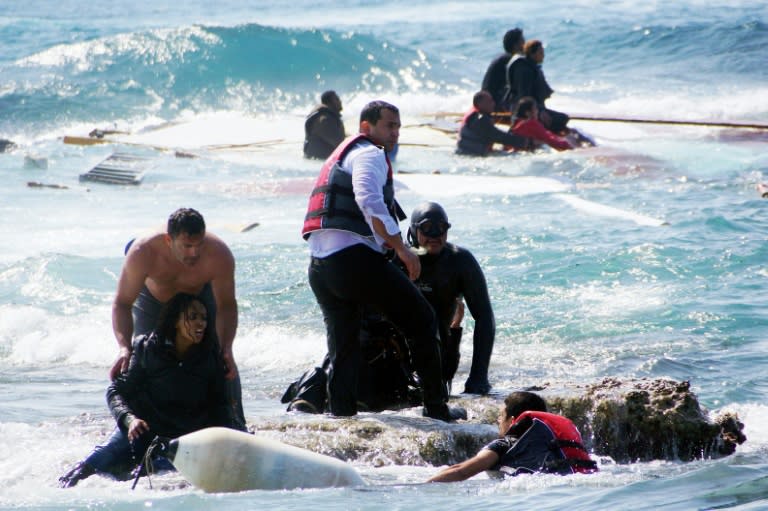 Migrants are rescued after their boat capsized off the Greek island of Rhodes, on April 20, 2015