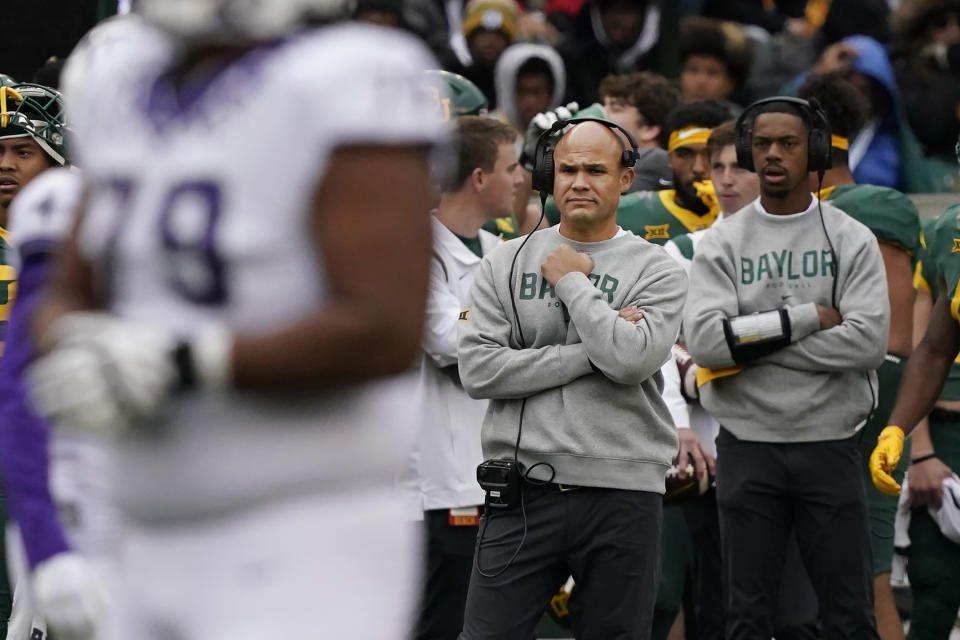 Baylor head coach Dave Aranda, center, watches from the sidelines during the first half of an NCAA college football game against TCU in Waco, Texas, Saturday, Nov. 19, 2022. (AP Photo/LM Otero)