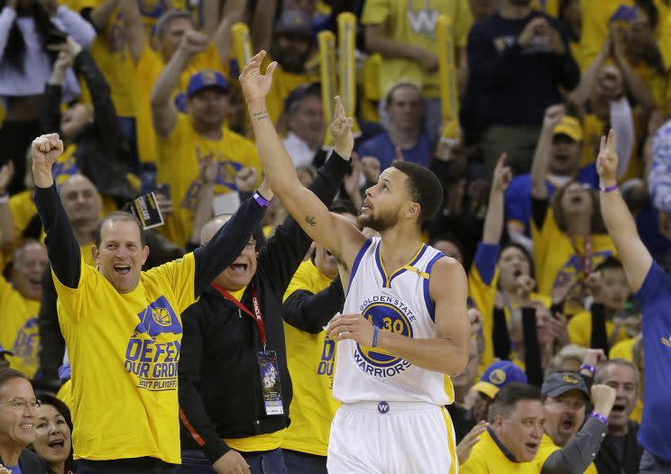 Stephen Curry feeds off the Oracle Arena crowd. (AP)