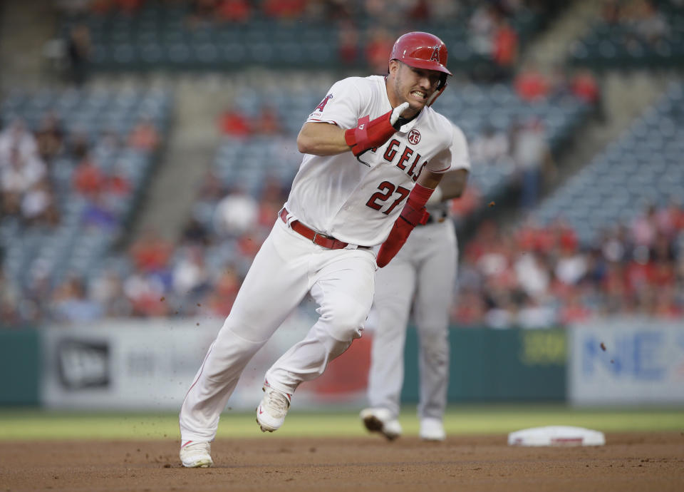 FILE - In this July 30, 2019, file photo, Los Angeles Angels' Mike Trout rounds second to advance to third from first on a single by Shohei Ohtani against the Detroit Tigers during the first inning of a baseball game in Anaheim, Calif. Trout was having another spectacular year for the Angels when right foot problems ended his season early. He did not play after Sept. 7 and was limited to 134 games. (AP Photo/Alex Gallardo, File)