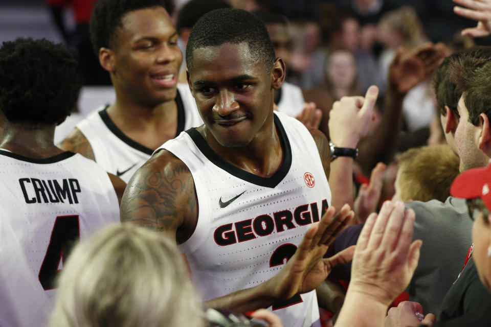 Georgia's Jordan Harris (2) celebrates with fans after the team's NCAA college basketball game against Tennessee on Wednesday, Jan. 15, 2020, in Athens, Ga. (Joshua L. Jones/Athens Banner-Herald via AP)