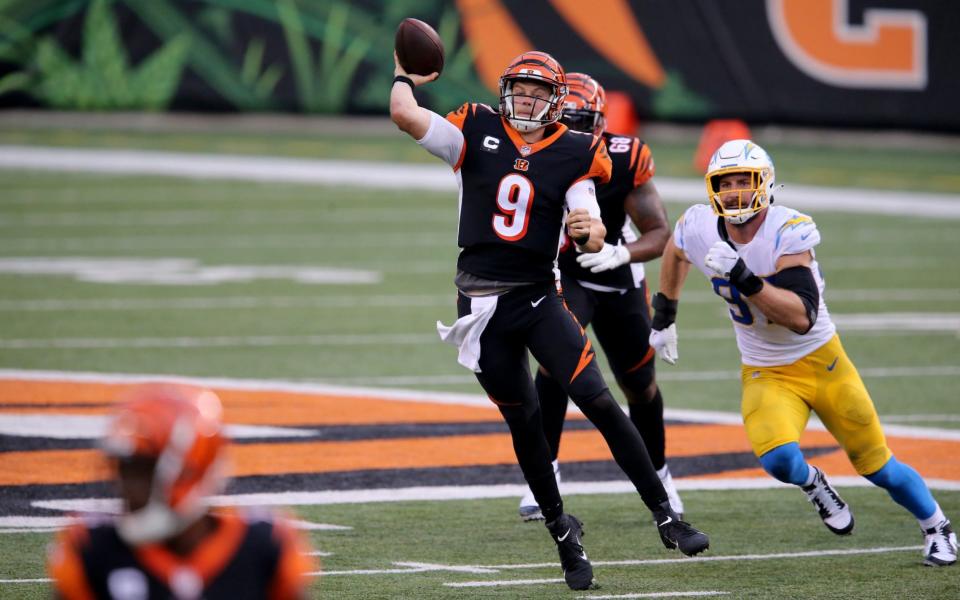 Cincinnati Bengals quarterback Joe Burrow (9) throws to Cincinnati Bengals wide receiver A.J. Green (18), bottom left, in the fourth quarter during a Week 1 NFL football game against the Los Angeles Chargers, Sunday, Sept. 13, 2020, at Paul Brown Stadium in Cincinnati. - Kareem Elgazzar/Cincinnati Enquirer-USA TODAY