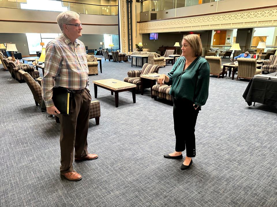 Private investigator Bobby Staton, left, speaks to Andrea Miller, director of Oklahoma City University's Innocence Project. Their client, Ricky Dority, was freed from prison in June with the help of students from the Innocence Project.