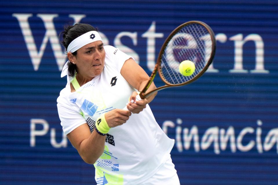 Ons Jabeur, of Tunisia, returns to Angelina Kalinina, of Ukraine, during the Western & Southern Open at the Lindner Family Tennis Center in Mason, Ohio, on Tuesday, Aug. 15, 2023.