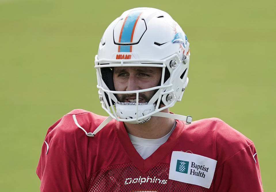 Josh Rosen with a Miami Dolphins helmet.