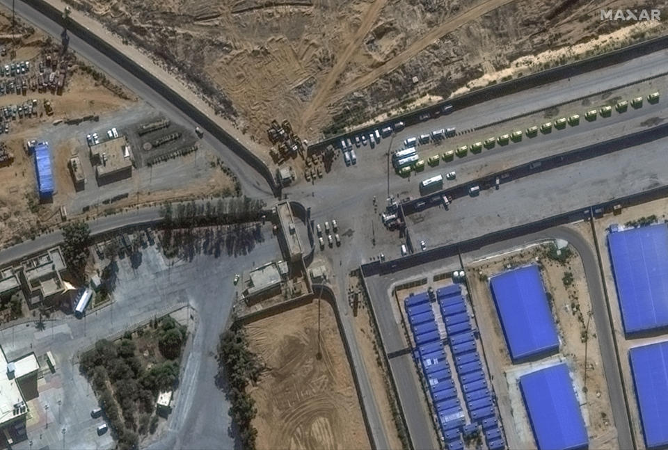 This image provided by Maxar Technologies shows a close view of the Rafah border crossing between Gaza and Egypt, with humanitarian-associated trucks lined up at and near the border, Tuesday, Nov. 7, 2023. (Satellite image ©2023 Maxar Technologies via AP)