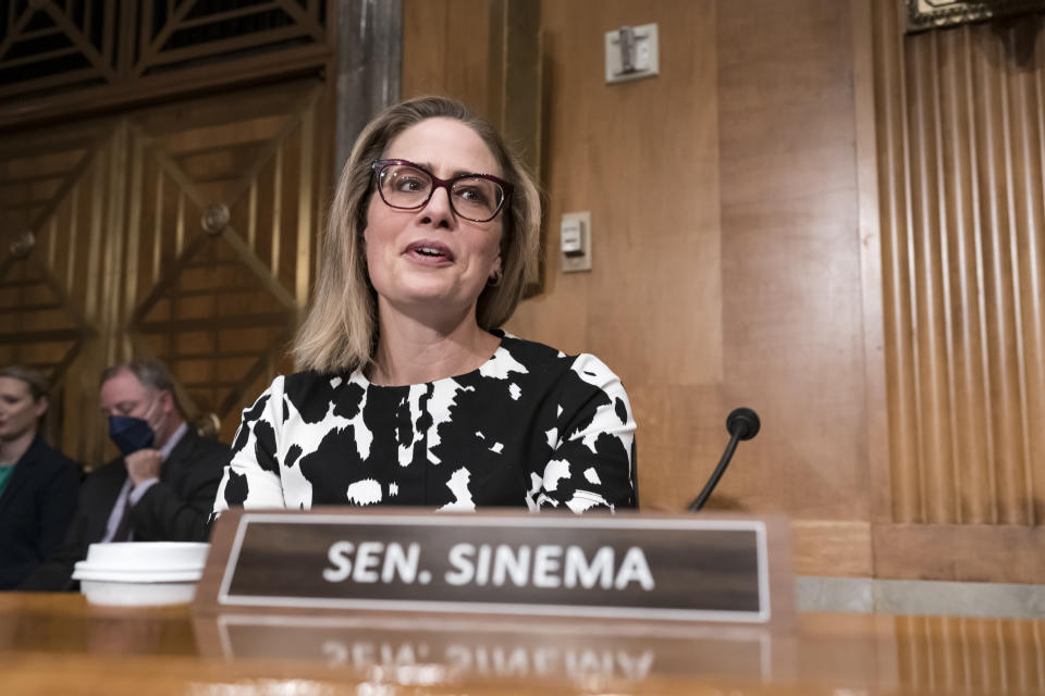 FILE -Then Sen. Kyrsten Sinema, D-Ariz., arrives for a meeting of the Senate Homeland Security Committee at the Capitol in Washington, Aug. 3, 2022. Independent Sen. Kyrsten Sinema of Arizona has announced that she won’t run for a second term. Her decision Tuesday comes after her estrangement from the Democratic Party left her politically homeless and without a clear path to reelection. (AP Photo/J. Scott Applewhite, File)