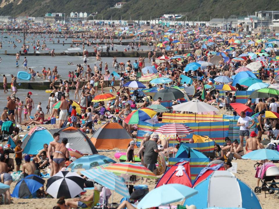 Throngs of people crowd Bournemouth beach in Dorset for third day in a row as heatwave continues: PA