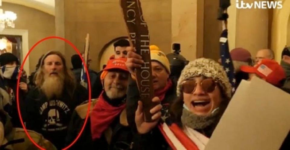 Robert Packer is seen inside the US Capitol in his ‘Camp Auschwitz’ shirt (DOJ)